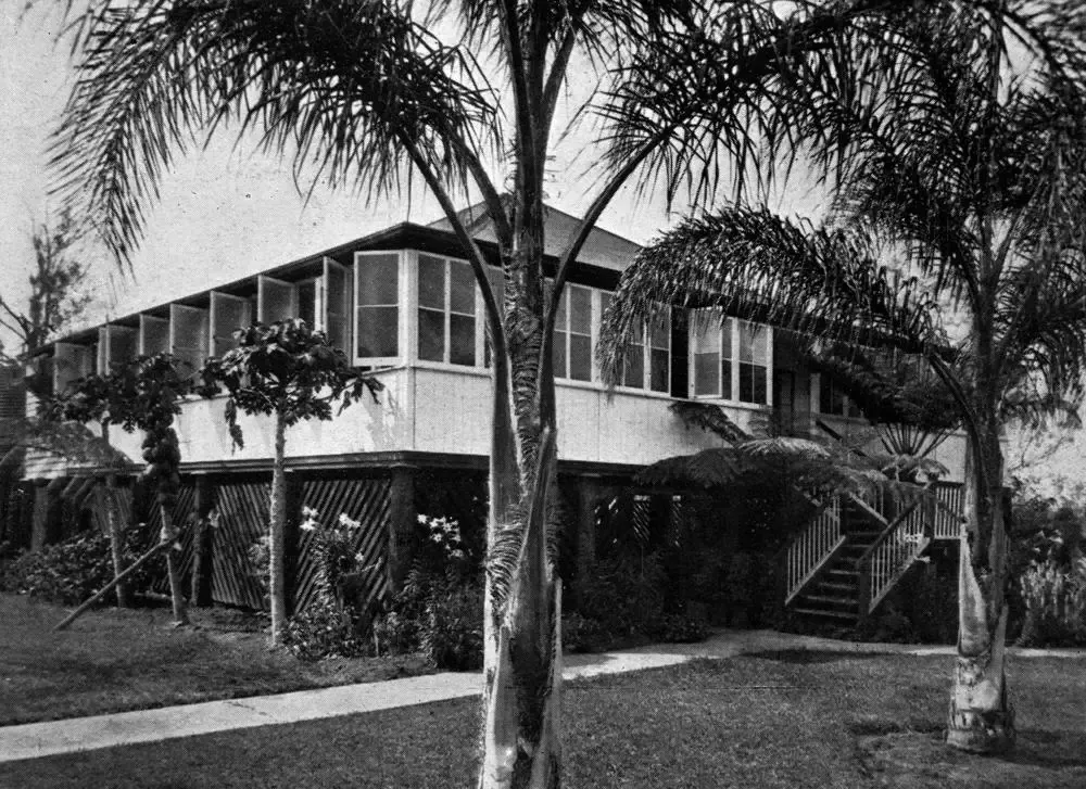 Classic elevated tropical home with lattice-screened undercroft and external stairs