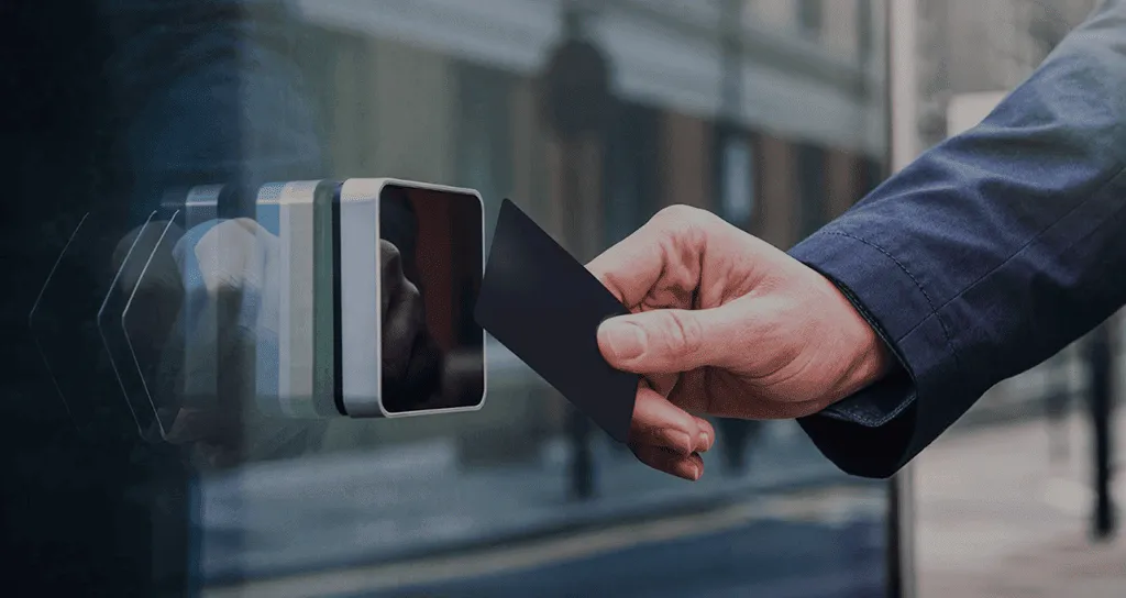 Staff member tapping an access control card at a reader